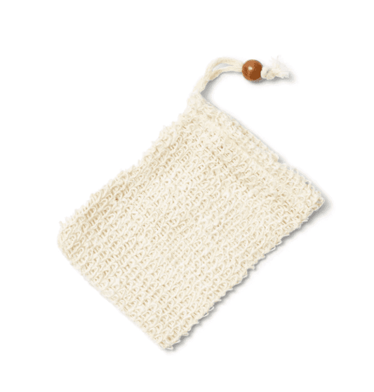 Made of natural sisal, this soap saver bag is durable and soft. Great for producing a generous lather and for exfoliating. A soap saver bag with drawstring and wooden bead  used to sinch the bag is laying on a white background.