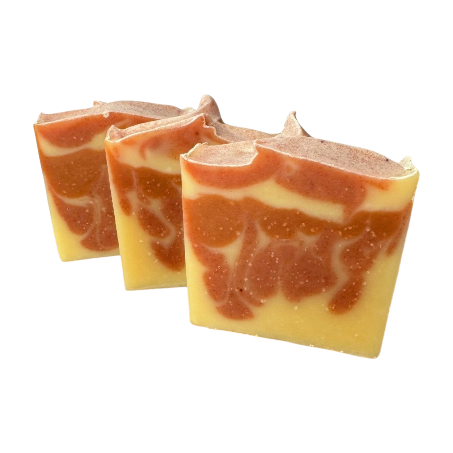 Three bars of this natural bar scented with Orange essential oils with a white background. This bar has orange swirls in a light yellow orange bar. 