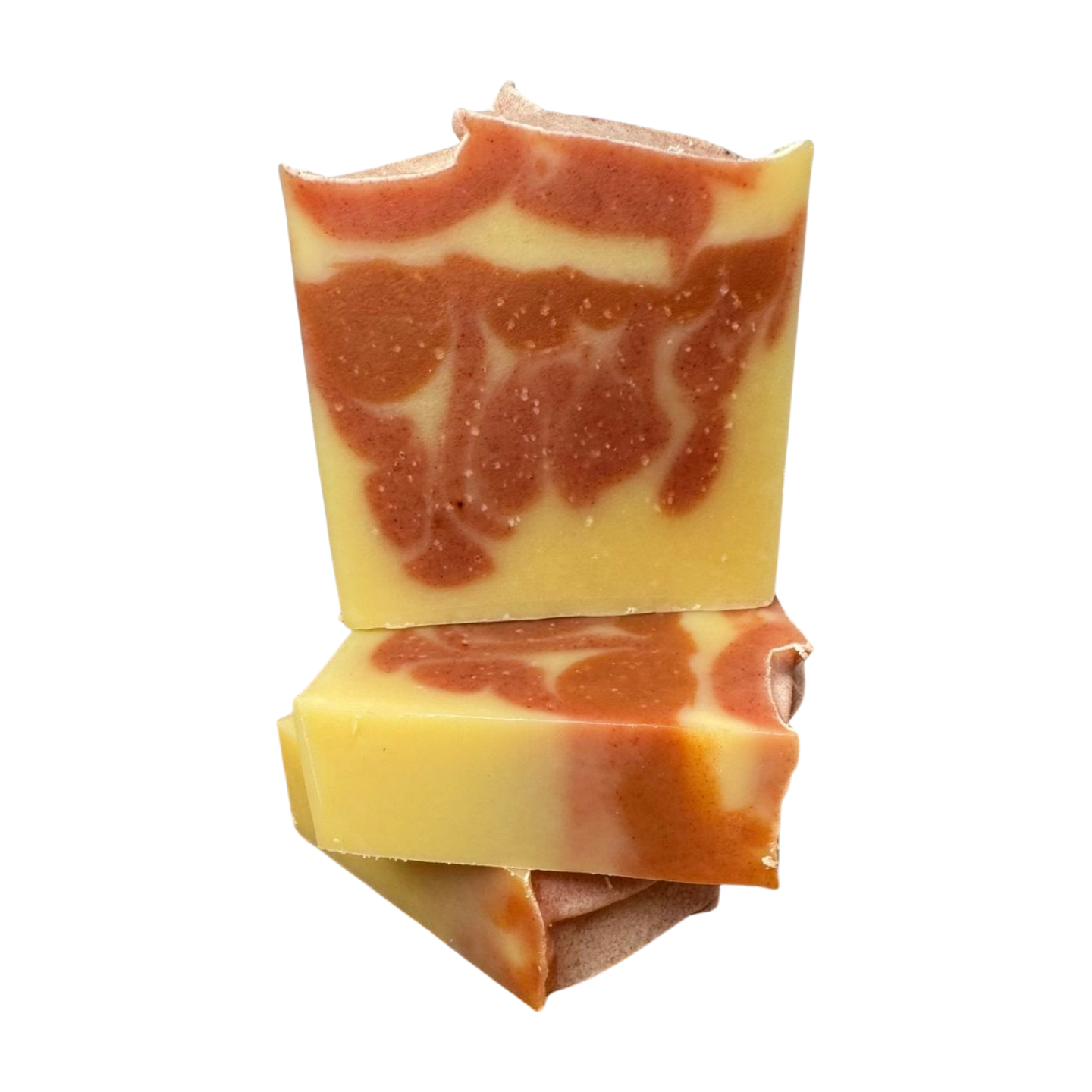 An all natural bar scented with Orange essential oil swith a white background. This bar has orange swirls in a light yellow orange bar. 