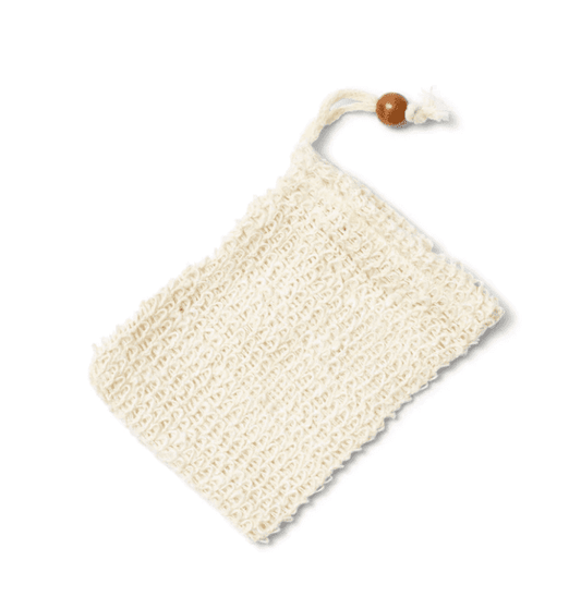 Made of natural sisal, this soap saver bag is durable and soft. Great for producing a generous lather and for exfoliating. A soap saver bag with drawstring and wooden bead  used to sinch the bag is laying on a white background. 